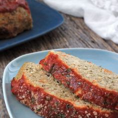 two slices of meatloaf sitting on top of a blue plate