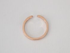 14K rose gold slightly tapered half eternity cuff ring set with round brilliant cut diamonds weighing 0.12 ct (G/VS2,SI1). 2.1 mm band, available in all sizes. Also available in 14K white or yellow gold, 18K (any color), platinum and palladium. Please send us an email for these options. *Made to order *SKU 16-101473 Rose Gold Stackable Open Band Rings, Stackable Rose Gold Open Band Midi Rings, Stackable Rose Gold Midi Rings With Open Band, Rose Gold Stackable Midi Rings With Open Band, Rose Gold Open Band Diamond Ring, Minimalist Rose Gold Ring With Tension Setting, Modern Rose Gold Midi Ring With Open Band, Diamond Cuff Ring, Cuff Ring