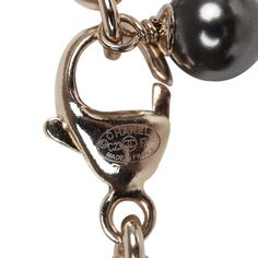 This Chanel necklace features a reversible Black glitter enamel heart charm with the classic CC motif on the front and a crystal embellished CC heart charm design on the reverse side. The chain is silver tone in a Rolo design with 6 black beads and faux crystals near the heart charm. The necklace features a lobster claw closure. Origin: France Condition: New and never worn Accompanied by: Chanel box and pouch, retail UPC Measurements: Chain 9" Pendant .75" x .75" Chanel Box, Chanel Necklace, Crystal Heart Pendant, Quality Handbags, Burberry Shoes, New Metal, Best Bags, Chanel Black, Black Glitter