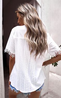 This shirt is GORGEOUS, no other way to say it! Featuring pretty floral lace, pleated detail, mocked neckline, button front, and a casual relaxed fit, this top has a beautiful beachy boho vibe! Pleated detail even continues down the back, so it’s beautiful coming or going! Super cute paired with distressed denim shorts, cuffed boyfriend jeans or cropped jeans for a fabulous summer outfit! Runs a tad large. If in between, choose your smaller size! Small 4/6, Medium 8/10, Large 12/14, XL 16/18, 2X 20/22 Material: 95% polyester, 5% spandex Semi- sheer, so you will want to layer over a nude or white tank or cami. Product measurements: S: bust 39 in, sleeve length 9 in, length 25 in, back length 24 in M: bust 41 in, sleeve length 9 in, length 26 in, back length 25 in L: bust 43 in, sleeve lengt Bohemian V-neck Lace Top For Vacation, Casual White Blouse With Boho Collar, Bohemian V-neck Lace Top For Day Out, Casual Blouse With Boho Collar For Spring, Bohemian Blouse With Lace Patchwork For Vacation, Summer Bohemian Blouse With Lace Patchwork, Spring Vacation Tops With Lace Patchwork, Summer Lace Top With Lace Patchwork For Day Out, Casual Summer Blouse With Lace Patchwork