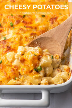 Wooden spoon scooping baked cheesy potatoes out of a white casserole dish. Cheesy Potatoes Casserole, Easy Cheesy Potatoes, Potatoes Casserole, Cheesy Potatoes Recipe, Yellow Squash Recipes, Cheesy Potato Casserole, Homemade Cheese Sauce, Oven Roasted Turkey, Cheesy Potato