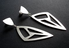 Sterling Silver Triangle CutOut Earrings, inspired by a close up look of the lotus leaf. - The earrings are hand cut from sterling silver sheet, hand drilled and sawed. - The earrings measure 7.3cm (2.9 inches) long by 2cm (0.8 inch) wide (at the widest point). - Sterling silver posts and butterfly stoppers. - Bright matte finish. These earrings are made to order and will be shipped within 6-8 business days from purchase. They will arrive securely gift wrapped via registered airmail. Feel free t Leaf Projects, Earrings Triangle, Lotus Earrings, Aluminum Jewelry, Silver Statement Earrings, Metal Clay Jewelry, Lotus Leaf, Street Market, Earrings Geometric