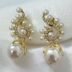 Ideal for those who love statement jewellery makes these baroque pearl Poseidon earrings the finishing touch for any special occasion outfit. The swirl tops are adorned with cubic zirconia and edged with small pearls with suspended baroque pearls, which change in the light with their iridescence. Pearls are a forever classic. They're the epitome of traditional style, an accessory that will never let you down. This timeless gemstone will take you to every significant event of your life. Materials Earrings White Gold, Occasion Outfit, Gemstone Drop Earrings, Statement Jewellery, Special Occasion Outfits, Earrings White, Baroque Pearls, Independent Designers Fashion, Statement Jewelry