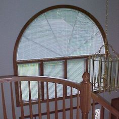 a baby crib in front of a round window