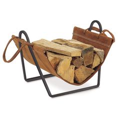 a firewood holder with logs in it and a bag on the back, against a white background