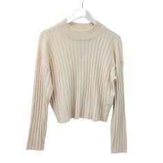 Beautiful cream color ribbed mock cropped sweater that is a great piece to wear alone or layer with a button down shirt underneath. Nice career piece or wear for a more casual day. NOTE that preloved pieces may have changed in size with wash and wear so please check approximate measurements for current size and fit.Size: Womens MApproximate Measurements Lying Flat: Bust 19.5 in Waist 19 in Length 19.5 inCondition: New With TagsAll pieces are stored in a smoke-free, pet-free environment. If flaws Ribbed Cropped Sweater For Fall Workwear, Fall Ribbed Cropped Sweater For Work, Casual White Cropped Sweater With Ribbed Neckline, Casual Cropped Sweater With Ribbed Cuffs For Work, Beige Cropped Sweater With Ribbed Cuffs For Spring, Spring Ribbed Sweater For Work, Cream Cropped Sweater For Fall, Trendy Cream Ribbed Sweater, Classic Long Sleeve Cropped Sweater