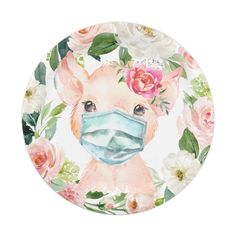 a plate with a face mask on it and flowers around the edges, all painted in watercolor