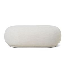 a white pillow sitting on top of a table