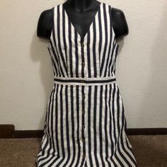 Lovely Button Up Dress To Own. Super Lightweight And Comfortable. It Is A Navy Blue Striped Color. Sorry If My Lighting Isn’t The Best. Perfect For The Spring And Summer. Pair This With One Of My Sandals In My Closet. Excellent Condition. Brand New With Tags. No Rips Tears Or Stains. Womens 4. Length 37”, Waist 15”, Pit To Pit 9”. Can’t Go Wrong With This Or This Brand. White Fitted Sleeveless Dress With Buttons, Fitted White Sleeveless Dress With Buttons, Fitted White Buttoned Sundress, Fitted White Sundress With Buttons, White Sleeveless Sundress With Button Closure, Knee-length Striped Dress With Buttons, White Casual Sleeveless Dress With Buttons, Sleeveless Mini Dress With Button Closure For Vacation, Casual V-neck Sleeveless Dress With Button Closure