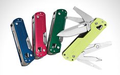 five multi - colored swiss army knifes in different colors