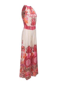 Get ready to slay on vacation with this Calypso jumpsuit in ivory, adorned with a playful pink and orange multicolored print. The unique mock neck tie detail adds a trendy touch to this already stylish jumpsuit. Complete the look with some wedges and a raffia crossbody bag! Size XS 95% Silk, 5% Spandex Mock neck tie closure Key hole back Smocked stretch waist Key hole front Bust 36" Waist 26" Shoulder to hem 60" Inseam 31" Elegant Pink Beach Jumpsuits And Rompers, Elegant Pink Jumpsuits And Rompers For Beach, Elegant Pink Jumpsuit For The Beach, White Floral Print Jumpsuits For Beach Season, White Floral Print Jumpsuits And Rompers For Beach Season, White Bohemian Jumpsuit For Vacation, Bohemian Beige Jumpsuits And Rompers For Beach, Beige Bohemian Jumpsuit For The Beach, Pink Beachwear Jumpsuits And Rompers For Vacation