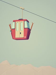 a red cable car suspended over a snow covered mountain