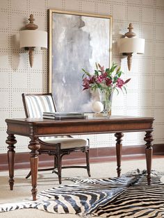 a room with a zebra print rug and table