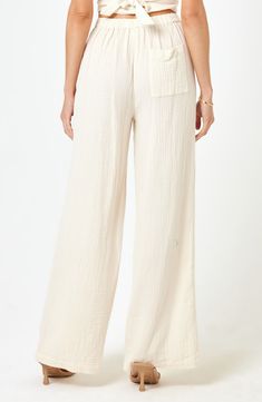 Take a break from the surf and relax in breezy cotton-gauze pants designed with a comfortable high waist and wide-leg silhouette. 31 1/2" inseam; 13" leg opening; 11 3/4" front rise; 15 1/2" back rise (size Small) Partial elastic waist Back patch pocket 100% cotton Hand wash, dry flat Full Length Cotton Wide Leg Beach Pants, Cotton Full Length Wide Leg Pants For Beach, Full Length Cotton Wide Leg Pants For Beach, Cotton Wide Leg Pants For The Beach, Breezy Wide Leg Cotton Bottoms, Breezy Wide Leg Loungewear Bottoms, Relaxed High Waist Cotton Pants, High Waist Relaxed Cotton Pants, Chic Cotton Pants For Beach