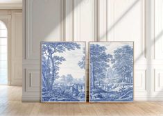 two blue and white paintings in an empty room