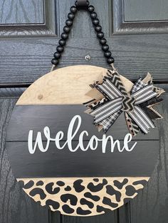 Welcome Shiplap Door or Wall Hanger with Leopard Print shows the 15 round hanging on a front door. Shiplap Door, Door Rounds, Wooden Wreaths, Round Wood Sign, 3d Hand