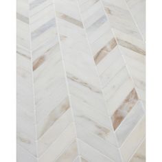 a white marble herringle tile flooring pattern