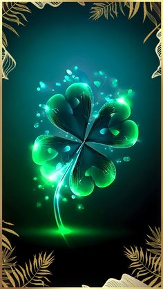 a green clover with water drops on it's petals and leaves surrounding the image