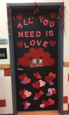 a door decorated with hearts and the words all you need is love