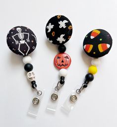 "Nurse Badge Reel, Fall Badge Reel, Retractable Badge, Halloween Badge Reel, ID Badge Holder, ID Badge Reel, Beaded Badge Reel, Badge Holder This halloween beaded badge reels are the perfect way to add some flair to your ID badge. These design are perfect for hospital staff, including nurses, doctors, pharmacists, and even nursing and medical students. Or anyone who wears a badge. These badges are now interchangeable. They are backed with heavy duty Velcro, allowing you to easily remove and chan Black Retractable Badge Holders As Gift, Black Retractable Badge Reel For Gift, Adjustable Black Retractable Badge Holder, Black Adjustable Retractable Badge Holders, Novelty Black Badge Reel Customizable, Customizable Black Novelty Badge Reel, Customizable Novelty Black Badge Reel, Black Badge Reel With Swivel Clip As A Gift, Customizable Black Badge Reel