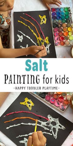 two children are painting with colorful crayons on black paper and the title says salt painting for kids happy toddler playtime