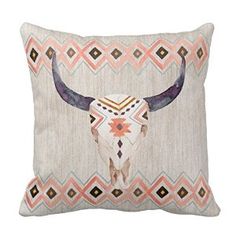 a pillow with an animal's skull on the front and geometric designs on the back