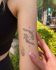 a woman with a tattoo on her arm