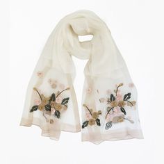 White embroidery scarf - Made in 40% silk, 60% wool. Scarf size measures 70cm in width and 192cm in length. Versatile and stylish, this scarf effortlessly elevates your ensemble, whether draped over your shoulders or intricately tied. Chic Cream Scarves For Spring, Chic Cream Scarf For Spring, Elegant Silk Shawl Scarf For Spring, Elegant Silk Shawl For Spring, Spring Silk Cream Scarves, Embroidered Silk Shawl Scarf, Elegant Embroidered Fall Shawl, Elegant Embroidered Shawl For Fall, Chic Cream Silk Scarf For Spring