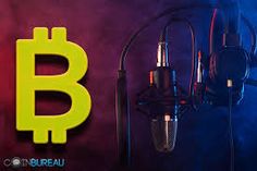 a microphone with a bitcoin sign on it and headphones hanging from the wall