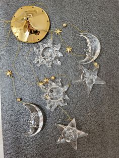 the moon and stars have been made out of clear acrylic material with gold accents