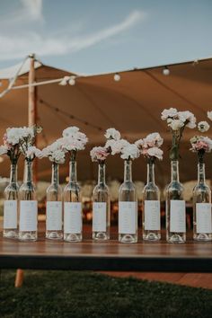 Charming Wedding Reception Tables Of Wine Barrels | sustainable | Eco-friendly wedding | Wedding Table Number Idea | Wine Bottle Table Numbers | rustic wedding | Elegant wedding | Cork decorations | Unique Wedding Ideas | Seating ideas | DIY Wedding Ideas #rusticwedding #weddinginspo #vineyardwedding #weddinginthewoods #rustic weddings Vineyard Wedding Inspiration, Sustainable Wedding, Wedding Table Plan, Wedding Table Decorations, Wine Wedding, Seating Plan, Wedding Mood Board, Seating Chart Wedding, Wedding Mood