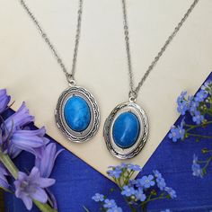 Semi-precious stone on a vintage brass, antiqued silver, or shiny silver oval locket, perfect to remember your loved ones. On 28 inches of antiqued brass chain. Choose from: Light Blue Sodalite, Blue Howlite, Blue Agate or Dark Blue Sodalite. I can change the chain to any length, just leave a note at checkout. Blue Oval Locket Necklace, Oval Blue Locket Necklace, Blue Oval Necklace With Natural Stones, Blue Gemstone Necklace With Oval Cabochon, Blue Oval Cabochon Gemstone Necklace, Blue Oval Link Necklace For Gift, Blue Oval Link Necklaces For Gift, Blue Oval Cabochon Necklace, Nickel-free Blue Oval Necklace