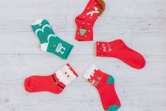 Step up your sock game this holiday season with these 5Pcs Christmas Cartoon Print Socks. These festive and quirky socks will add a touch of playfulness to any outfit. With their fun prints, they are sure to make you stand out from the crowd. Perfect for spreading holiday cheer! Model Info: Models are 5'7", Size 2, wearing smalls Material: 100% Polyester Fun Christmas Gift Socks, Novelty Winter Socks For Gift, Novelty Winter Socks For Gifts, Novelty Socks For Winter Gift, Novelty Winter Socks As Gift, Cute Red Socks For Gifts, Playful Christmas Socks For Stocking Stuffers, Fun Red Socks For Gifts, Novelty Christmas Gift Socks