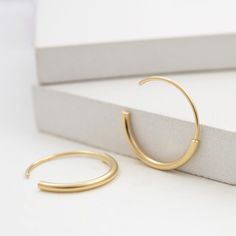 "A timeless classy earrings for a modern style, you can truly wear these gold medium everyday hoops with any outfit and they will look beautiful. Designed from a combination of a half hoop of 2mm soldered to a thiner half hoop of 1mm going through the lobe. Handmade by 22K yellow gold fill over sterling silver (5 micrometers of gold) also available in sterling silver, both matte finished. Hoops measure 22mm in diameter. Post of 19 gauge wire // 1mm diameter This listing is for one pair of earrin Chic Everyday Hoop Huggie Earrings, Minimalist Everyday Hoop Earrings, Chic Gold Plated Hoop Earrings For Everyday, Chic Everyday Gold Plated Hoop Earrings, Chic 14k Gold Small Hoop Earrings, Chic Everyday Hoop Earrings, Chic Small Hoop Earrings For Everyday, Modern Tarnish Resistant Hoop Earrings, Minimalist Diamond Hoop Earrings