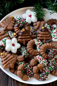 a white plate topped with cookies and pretzels