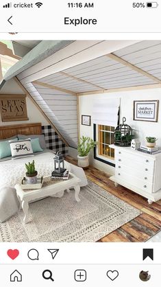 an image of a bedroom with white furniture and wood flooring on the bottom level