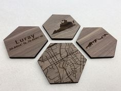 four wooden coasters with the names and map of luray, la jolla, los angeles