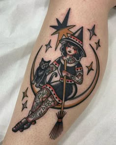 a woman sitting on top of a broom with an owl and stars around her leg