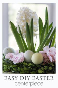 an arrangement of flowers and eggs on a table