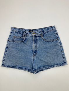 Vintage Womens Blue Denim Jean Shorts Waist: 34" Length: 3" Instagram: @markham.vtg Please remember most, if not all of our items are vintage and used. Therefore it will naturally have some wear and tear. Refer to photos for any flaws and measurements for sizing. Retro Mid-rise Jean Shorts In Medium Wash, Retro Mid-rise Denim Jean Shorts, Retro Mid-rise Medium Wash Jean Shorts, Retro Fitted Medium Wash Jean Shorts, Retro Short Jeans In Medium Wash, Classic Fitted Medium Wash Jean Shorts, Vintage Medium Wash Straight Leg Shorts, Classic Fitted Denim Jean Shorts, Retro High-rise Jean Shorts In Medium Wash