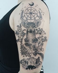 a woman with a deer tattoo on her shoulder