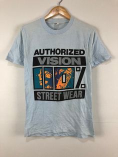 "Vintage Vision Street Wear Skateboard T-Shirt Pre-owned: Good condition Size L Measurement Pit to pit 15.5\" Length 26\" I do combined shipping $3 for next t-shirt Please let me know if you have any question before buying." Urban Crew Neck T-shirt For Skateboarding, Tri-blend Graphic T-shirt For Streetwear, Vintage Text Print T-shirt For Streetwear, Urban Tri-blend T-shirt For Streetwear, Retro Tri-blend T-shirt For Streetwear, Tri-blend Retro T-shirt For Streetwear, Graphic Cotton T-shirt For Skateboarding, Unisex Blue T-shirt For Streetwear, Screen Print T-shirt For Urban Adventures