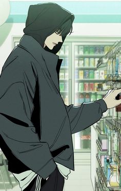 a man in a hooded jacket is looking at the shelves