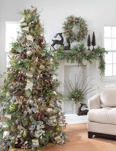 a decorated christmas tree in front of a fireplace