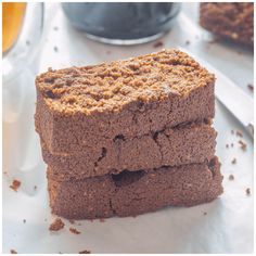 two pieces of brownie sitting on top of a table