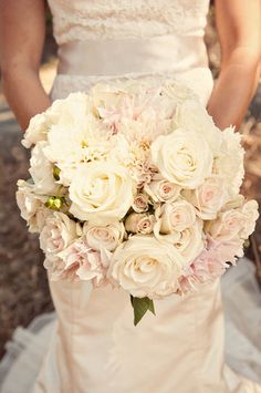 a bride holding a bouquet of flowers in her hand, with the caption's name below it