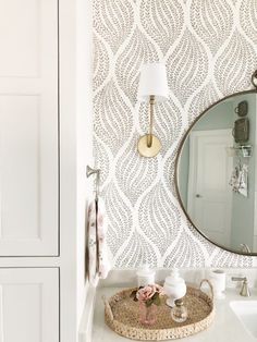 a bathroom sink with a mirror above it