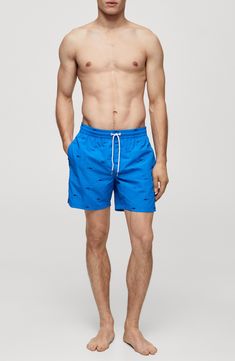 No need to fish for compliments in these sporty embroidered swim trunks topped with a comfy drawstring waist. Elastic/drawstring waist Side-seam pockets; back patch pocket Lined 100% polyamide Machine wash, line dry Imported Casual Relaxed Fit Swim Trunks For Pool, Casual Cotton Swimwear With Drawstring, Casual Swimwear With Pockets For Pool, Casual Pool Shorts With Side Pockets, Casual Shorts With Side Pockets For Pool, Blue Cotton Swimwear With Drawstring, Casual Blue Swim Trunks With Side Pockets, Casual Swimwear With Functional Drawstring For Pool, Cotton Pool Shorts With Pockets