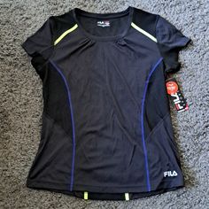 An Eye-Catching Neon Yellow, Blue, And Black Running Shirt From Fila Features A Media Pocket And Moisture Wicking Technology. Chest Across (Pit To Pit) Is Approximately 19.5 Inches. Length From Back Is Approximately 25.5 Inches. Running Shirts, Blue And Black, Neon Yellow, Yellow Blue, Moisture Wicking, Colorful Shirts, Neon, Womens Tops, Tops & Tees