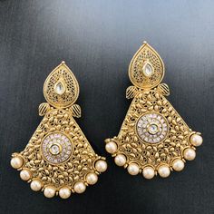 Pearl Kundan Stone Earrings/Blue Golden Chandbali Earrings/Statement Earrings/Golden Earrings/Ethnic Kundan Indian Chandbali/Indian Earrings Length: Approx. 3 Inches Comes with push back closure Made in Brass with Pearl beads Handmade Jewelry This pair of earring is made in Gold finish with Semi precious stone beads with Push back closure. Very Elegant and stylish, these earrings can be paired with any traditional Indian or Western Attire depending upon the occasion and the theme. Very lightweig Festive Chandbali Pierced Earrings, Celebration Filigree Chandbali Danglers, Pierced Chandbali Bridal Earrings For Festive Occasions, White Earrings With Intricate Design For Diwali, Pierced Chandbali Bridal Earrings For Celebration, Festive Chandbali Bridal Earrings, Traditional Dangle Pearl Earrings, Traditional White Pearl Earrings, Celebration Chandbali Filigree Danglers